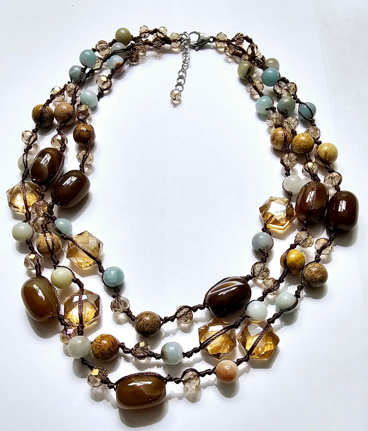 Double knotted 17-inch necklace featuring agate, amazonite, and jasper crystals with a sterling silver clasp. This spiritual healing gemstone jewelry combines natural stones known for their calming and balancing properties. Handmade with care, the necklace offers both style and wellness benefits. Perfect as a thoughtful gift for her, it complements boho and mindful fashion, adding a meaningful touch to any outfit with its earthy, healing vibe