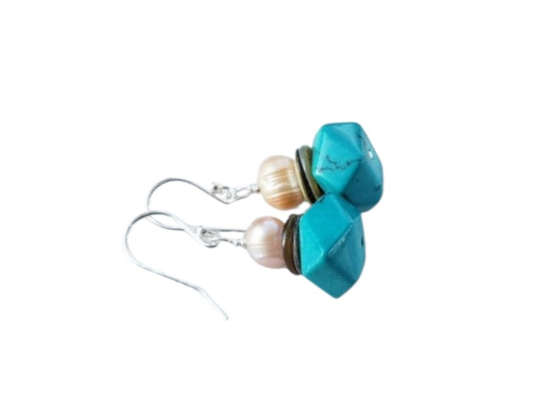 Handmade Turquoise and Natural Pearl Earrings featuring Akoya shell and sterling silver accents in a bold boho beaded statement design. These artisanal earrings blend oceanic charm with vibrant turquoise tones, perfect for women who love unique, nature-inspired costume jewelry. Lightweight and eye-catching, ideal for festivals, beach outings, or casual chic wear. A thoughtful handmade gift for her, combining coastal elegance with bohemian flair for any occasion.
