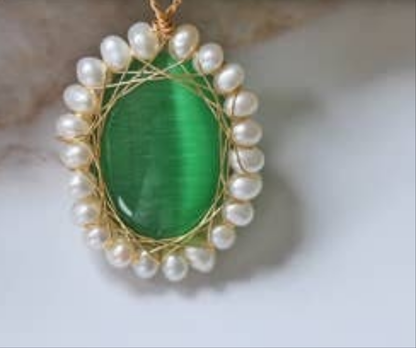 Amazonite Green Pendant Necklace featuring chunky freshwater pearl beads and natural amazonite gemstones in a bold statement design. This handcrafted necklace blends soothing green tones with lustrous pearls for a unique, eye-catching accessory. Perfect gift for women who love artisanal jewelry with a boho-chic vibe. Ideal for adding elegance and natural beauty to casual or formal outfits. Handmade jewelry combining style and positive energy.