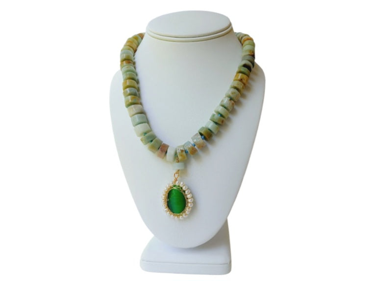 Amazonite Green Pendant Necklace featuring chunky freshwater pearl beads and natural amazonite gemstones in a bold statement design. This handcrafted necklace blends soothing green tones with lustrous pearls for a unique, eye-catching accessory. Perfect gift for women who love artisanal jewelry with a boho-chic vibe. Ideal for adding elegance and natural beauty to casual or formal outfits. Handmade jewelry combining style and positive energy.