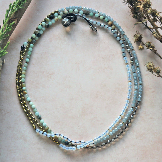 Minimalist Amazonite Hematite Necklace featuring a delicate handmade design with calming amazonite and grounding hematite gemstones. This women’s gemstone jewelry piece blends natural beauty with boho chic style, perfect for layering or wearing alone. Lightweight and versatile, it’s an ideal gift for her on birthdays, holidays, or special occasions. Combining spiritual energy with understated elegance, this necklace adds a peaceful, earthy touch to any modern outfit.