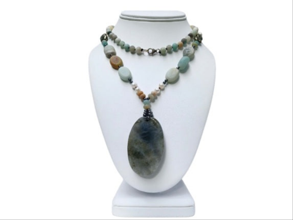 Long beaded amazonite necklace for women featuring pearls, labradorite, hematite, and pyrite for a bold statement look. This handcrafted necklace blends soft and earthy tones with natural gemstones known for their beauty and healing properties. Perfect for layering or wearing alone, it adds elegance to boho and everyday styles. A unique gift for her, this versatile necklace brings together calming energy and sophisticated design in one stunning piece.