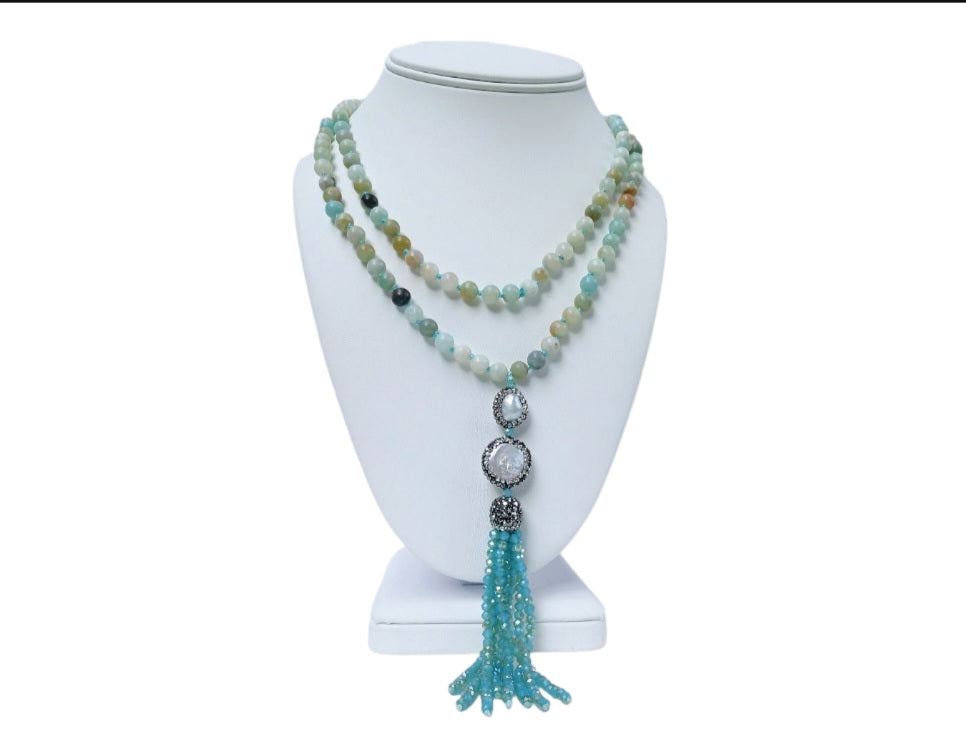 Handmade 21-inch Amazonite and Pearl Tassel Necklace featuring natural gemstones designed to promote success, abundance, and calm energy. This long yoga necklace combines soothing amazonite beads with elegant pearls and a stylish tassel, perfect for meditation or everyday wear. Lightweight and beautifully crafted, it makes a meaningful gift for her seeking balance, positivity, and spiritual growth through gemstone jewelry.