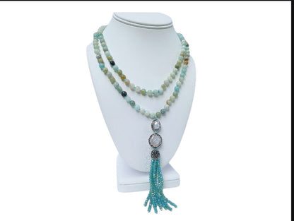 Handmade 21-inch Amazonite and Pearl Tassel Necklace featuring natural gemstones designed to promote success, abundance, and calm energy. This long yoga necklace combines soothing amazonite beads with elegant pearls and a stylish tassel, perfect for meditation or everyday wear. Lightweight and beautifully crafted, it makes a meaningful gift for her seeking balance, positivity, and spiritual growth through gemstone jewelry.