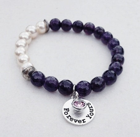 Natural Amethyst Bracelet paired with lustrous freshwater pearls and set on a delicate sterling silver chain. This elegant and inspirational bracelet is perfect as an anniversary gift or meaningful present for women who appreciate handcrafted gemstone jewelry. Combining the calming energy of amethyst with the classic beauty of pearls, it’s a timeless piece that symbolizes peace, love, and wisdom—ideal for special occasions, everyday wear, or thoughtful gifting.