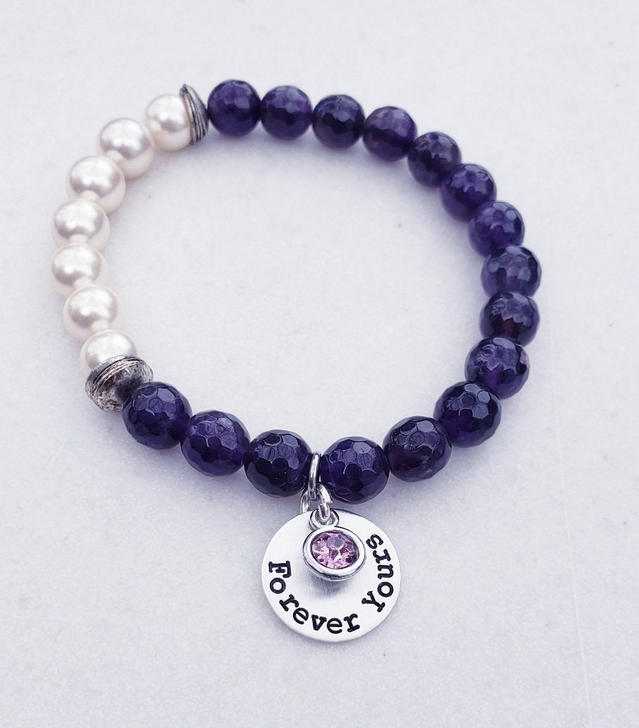 Natural Amethyst Bracelet paired with lustrous freshwater pearls and set on a delicate sterling silver chain. This elegant and inspirational bracelet is perfect as an anniversary gift or meaningful present for women who appreciate handcrafted gemstone jewelry. Combining the calming energy of amethyst with the classic beauty of pearls, it’s a timeless piece that symbolizes peace, love, and wisdom—ideal for special occasions, everyday wear, or thoughtful gifting.