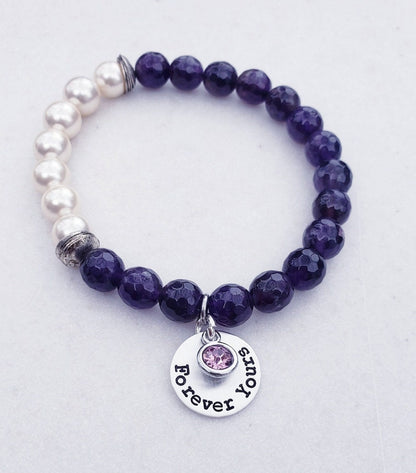 Natural Amethyst Bracelet paired with lustrous freshwater pearls and set on a delicate sterling silver chain. This elegant and inspirational bracelet is perfect as an anniversary gift or meaningful present for women who appreciate handcrafted gemstone jewelry. Combining the calming energy of amethyst with the classic beauty of pearls, it’s a timeless piece that symbolizes peace, love, and wisdom—ideal for special occasions, everyday wear, or thoughtful gifting.