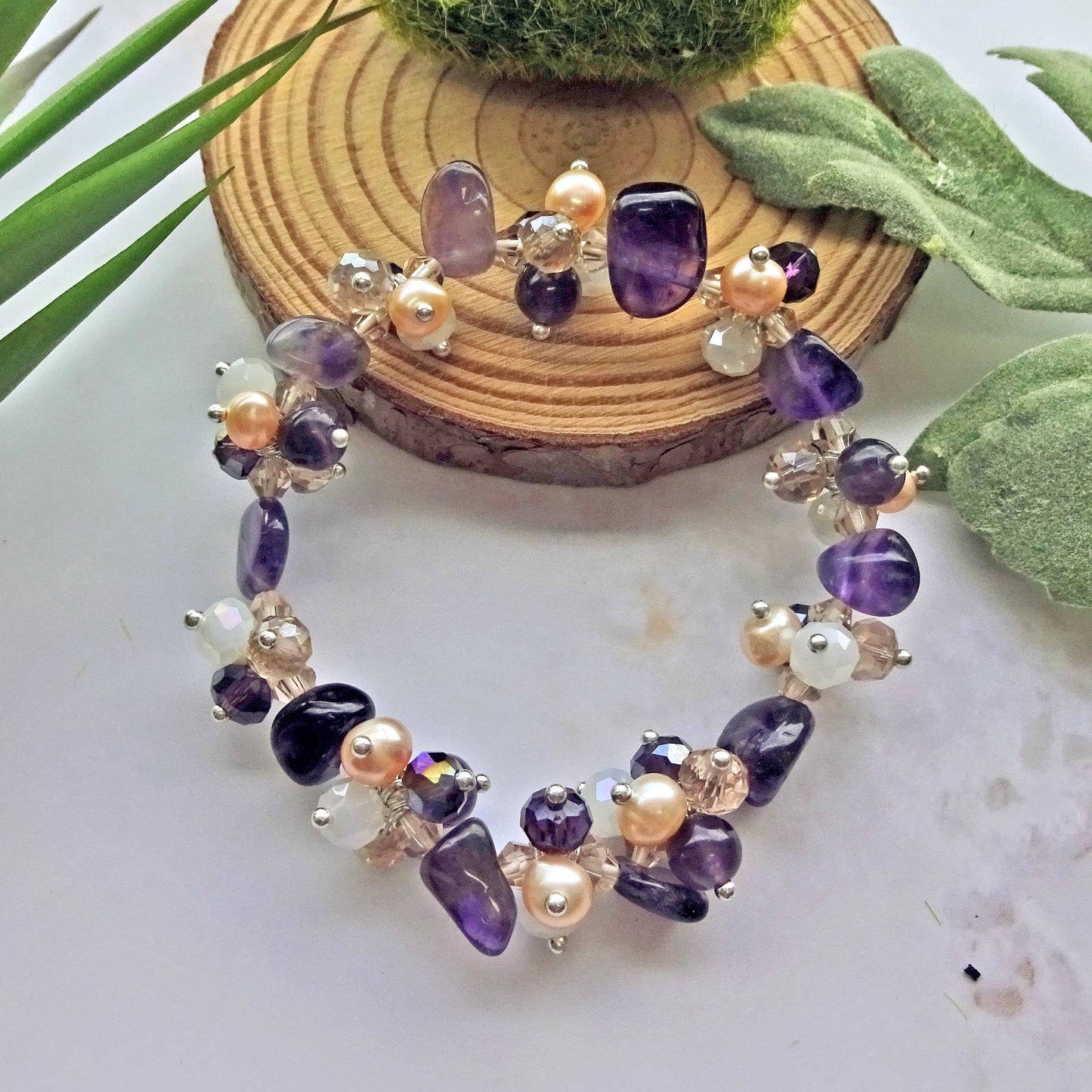 Amethyst Pearl Multi-Stone Stretch Bracelet featuring natural crystal beads designed for style and healing. This chakra bracelet includes amethyst, freshwater pearls, and complementary gemstones to promote balance, clarity, and calm energy. Perfect for those who love natural stone jewelry with spiritual meaning, this handcrafted beaded bracelet is a beautiful accessory for yoga, meditation, or everyday wear—combining elegance, wellness, and boho-inspired charm.