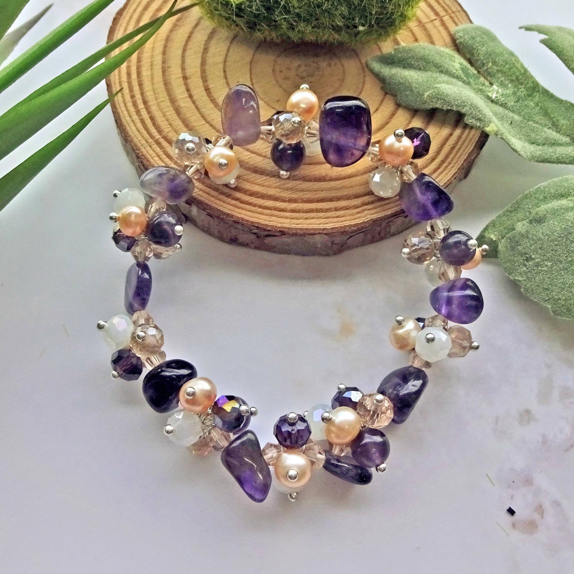 Amethyst Pearl Multi-Stone Stretch Bracelet featuring natural crystal beads designed for style and healing. This chakra bracelet includes amethyst, freshwater pearls, and complementary gemstones to promote balance, clarity, and calm energy. Perfect for those who love natural stone jewelry with spiritual meaning, this handcrafted beaded bracelet is a beautiful accessory for yoga, meditation, or everyday wear—combining elegance, wellness, and boho-inspired charm.