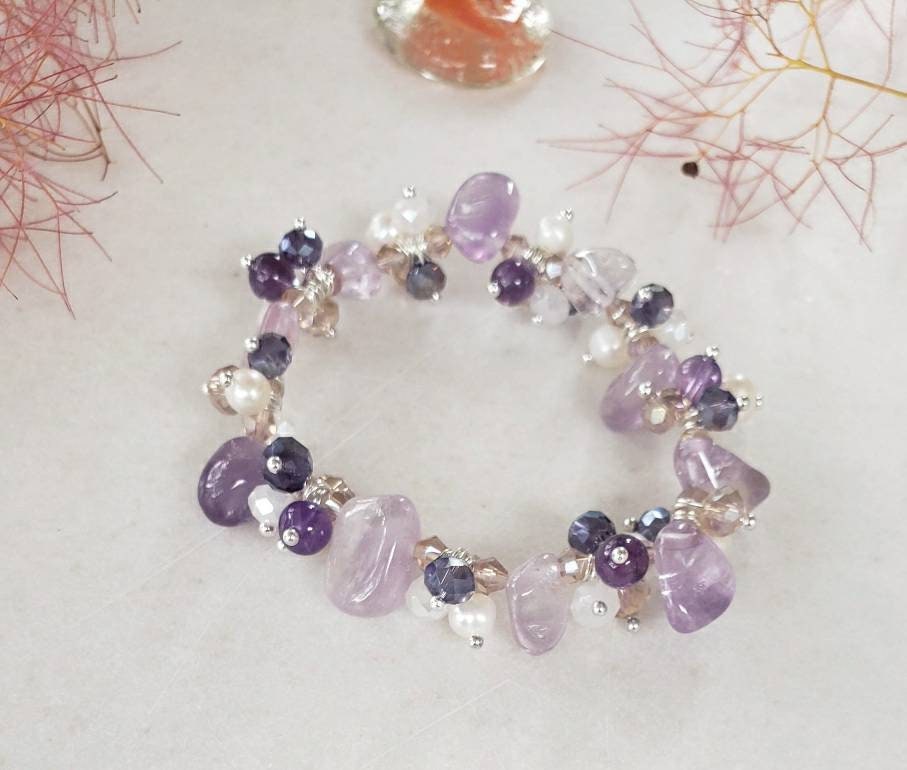 Amethyst Pearl Multi-Stone Stretch Bracelet featuring natural crystal beads designed for style and healing. This chakra bracelet includes amethyst, freshwater pearls, and complementary gemstones to promote balance, clarity, and calm energy. Perfect for those who love natural stone jewelry with spiritual meaning, this handcrafted beaded bracelet is a beautiful accessory for yoga, meditation, or everyday wear—combining elegance, wellness, and boho-inspired charm.
