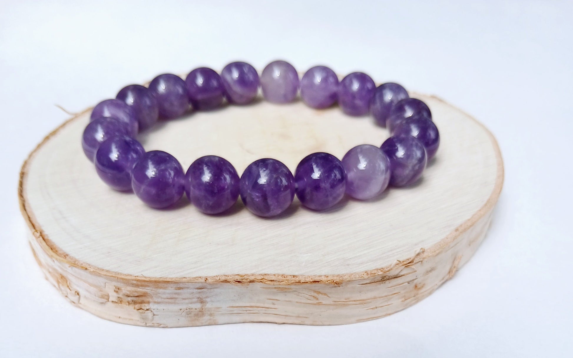 Amethyst crystal bracelet made with natural stones, designed for women seeking healing and spiritual balance. This purple crystal jewelry is perfect for yoga and meditation practices, promoting calmness, stress relief, and clarity. Handmade with care, it serves as a thoughtful gift for her, combining elegance and energy healing properties to support mindfulness and emotional well-being in everyday life.
