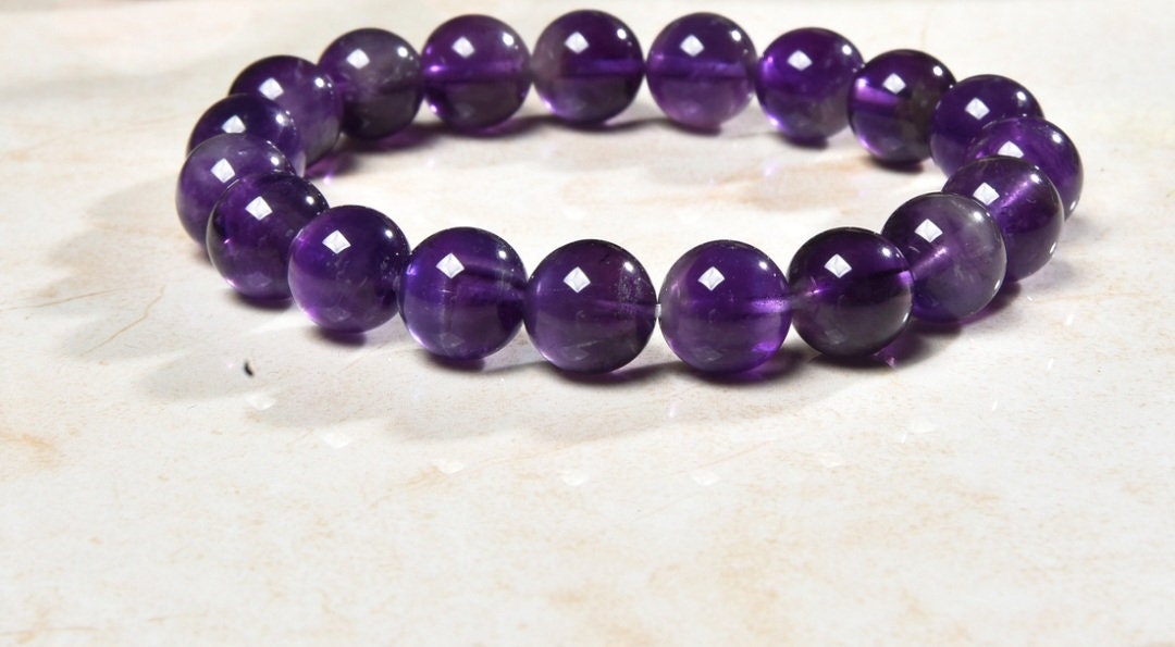 Amethyst crystal bracelet made with natural stones, designed for women seeking healing and spiritual balance. This purple crystal jewelry is perfect for yoga and meditation practices, promoting calmness, stress relief, and clarity. Handmade with care, it serves as a thoughtful gift for her, combining elegance and energy healing properties to support mindfulness and emotional well-being in everyday life.