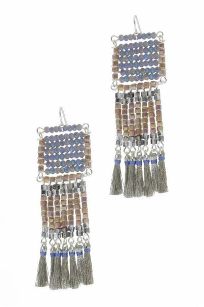 Anjuna Glass Beaded Tassel Earrings featuring large boho fringe design with vibrant glass beads, handmade for women who love bold statement jewelry. These colorful earrings add playful movement and artistic flair to any outfit, perfect for festivals, casual wear, or special occasions. Lightweight and eye-catching, they make a thoughtful handmade gift for women who appreciate unique, artisanal bohemian accessories that stand out.