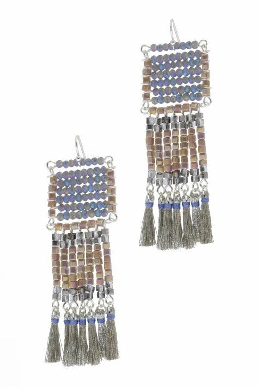 Anjuna Glass Beaded Tassel Earrings featuring large boho fringe design with vibrant glass beads, handmade for women who love bold statement jewelry. These colorful earrings add playful movement and artistic flair to any outfit, perfect for festivals, casual wear, or special occasions. Lightweight and eye-catching, they make a thoughtful handmade gift for women who appreciate unique, artisanal bohemian accessories that stand out.