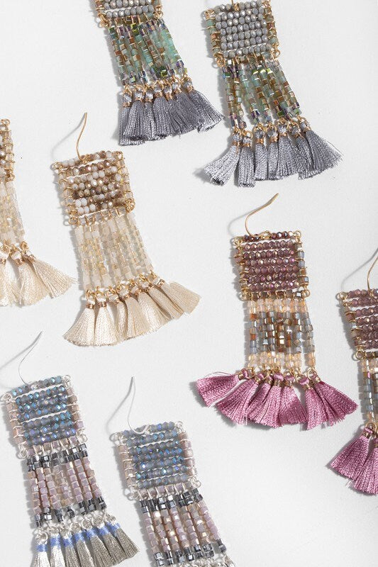 Anjuna Glass Beaded Tassel Earrings featuring large boho fringe design with vibrant glass beads, handmade for women who love bold statement jewelry. These colorful earrings add playful movement and artistic flair to any outfit, perfect for festivals, casual wear, or special occasions. Lightweight and eye-catching, they make a thoughtful handmade gift for women who appreciate unique, artisanal bohemian accessories that stand out.