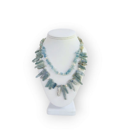Elegant handmade necklace featuring Aquamarine, Kyanite, and freshwater Pearls, designed for women who love natural aqua-toned jewelry. This unique piece combines soft blue and white hues for a calming, ocean-inspired look. Perfect as a gift for her or a stylish addition to your own jewelry collection, it’s ideal for birthdays, anniversaries, or special occasions. A delicate yet striking women’s necklace crafted with care and intention.