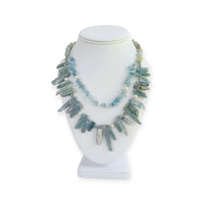 Elegant handmade necklace featuring Aquamarine, Kyanite, and freshwater Pearls, designed for women who love natural aqua-toned jewelry. This unique piece combines soft blue and white hues for a calming, ocean-inspired look. Perfect as a gift for her or a stylish addition to your own jewelry collection, it’s ideal for birthdays, anniversaries, or special occasions. A delicate yet striking women’s necklace crafted with care and intention.