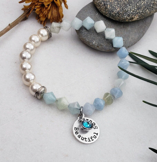 Aquamarine Pearl Bracelet featuring handmade beaded design combining soothing aquamarine stones with lustrous pearls. This inspirational jewelry piece is perfect as a March birthstone gift, symbolizing calmness, courage, and good luck. Ideal for her or as a thoughtful mother’s gift, it blends elegant style with meaningful healing properties. Lightweight and versatile, this bracelet adds a delicate, spiritual touch to everyday wear or special occasions, celebrating love and positive energy.