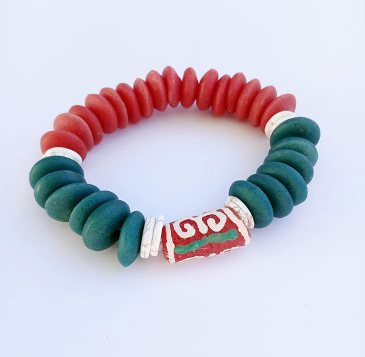 Ashanti-inspired green, red, and white glass beaded bracelet featuring bold, chunky African jewelry design. Handcrafted to reflect rich cultural heritage, this vibrant bracelet blends traditional African artistry with Native American and Southwestern style influences. A striking gift for her, perfect for those who appreciate unique, ethnic accessories that celebrate identity, color, and craftsmanship