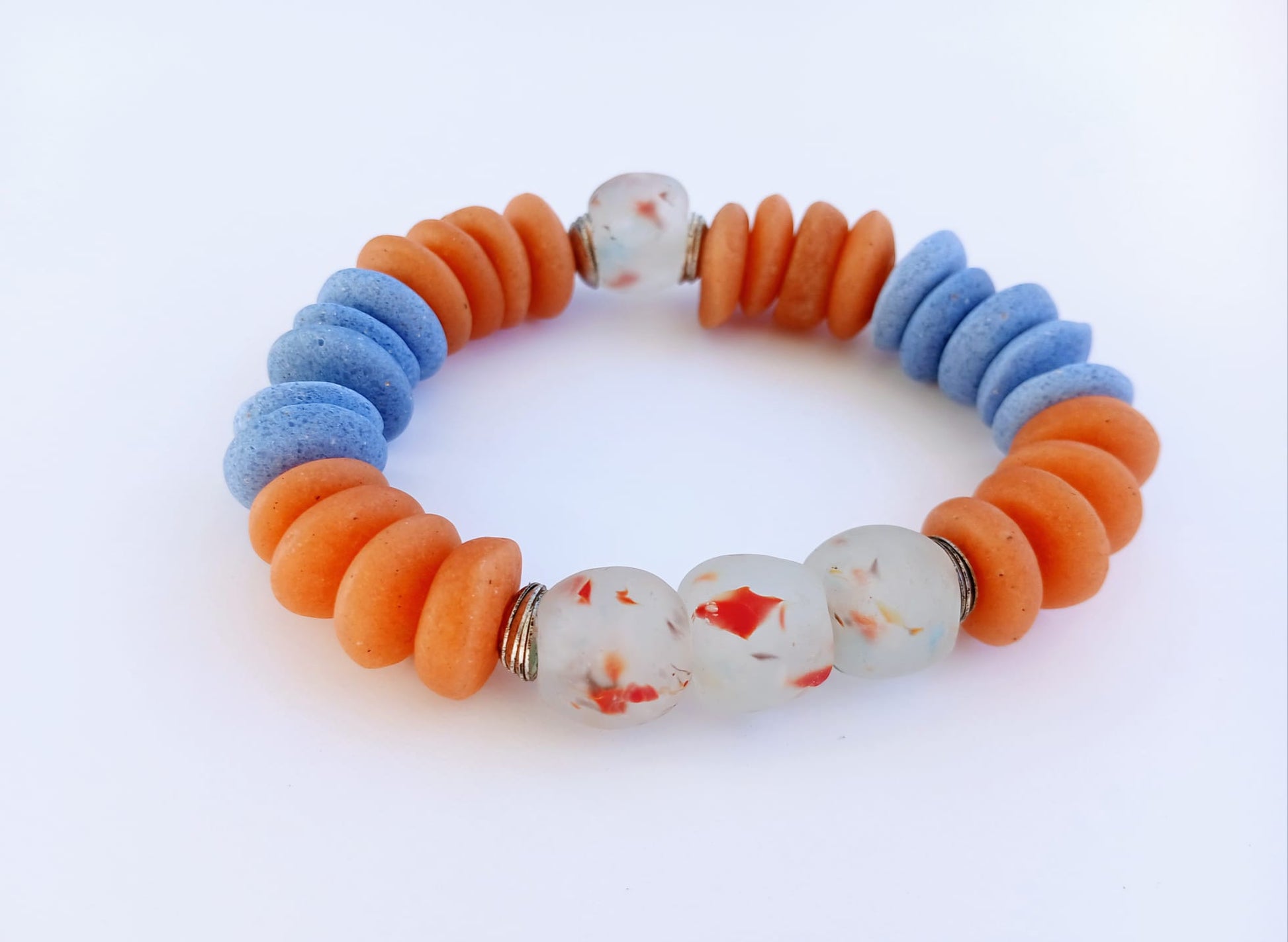 Orange and Blue Ashanti Glass Beaded Bracelet featuring multicolor handmade beads crafted into a vibrant healing jewelry piece for men and women. This lucky charm bracelet blends traditional Ashanti craftsmanship with modern style, promoting positive energy and spiritual balance. Lightweight and durable, it makes a meaningful gift for him or her, perfect for everyday wear or special occasions, combining artisanal quality with bold, colorful design.