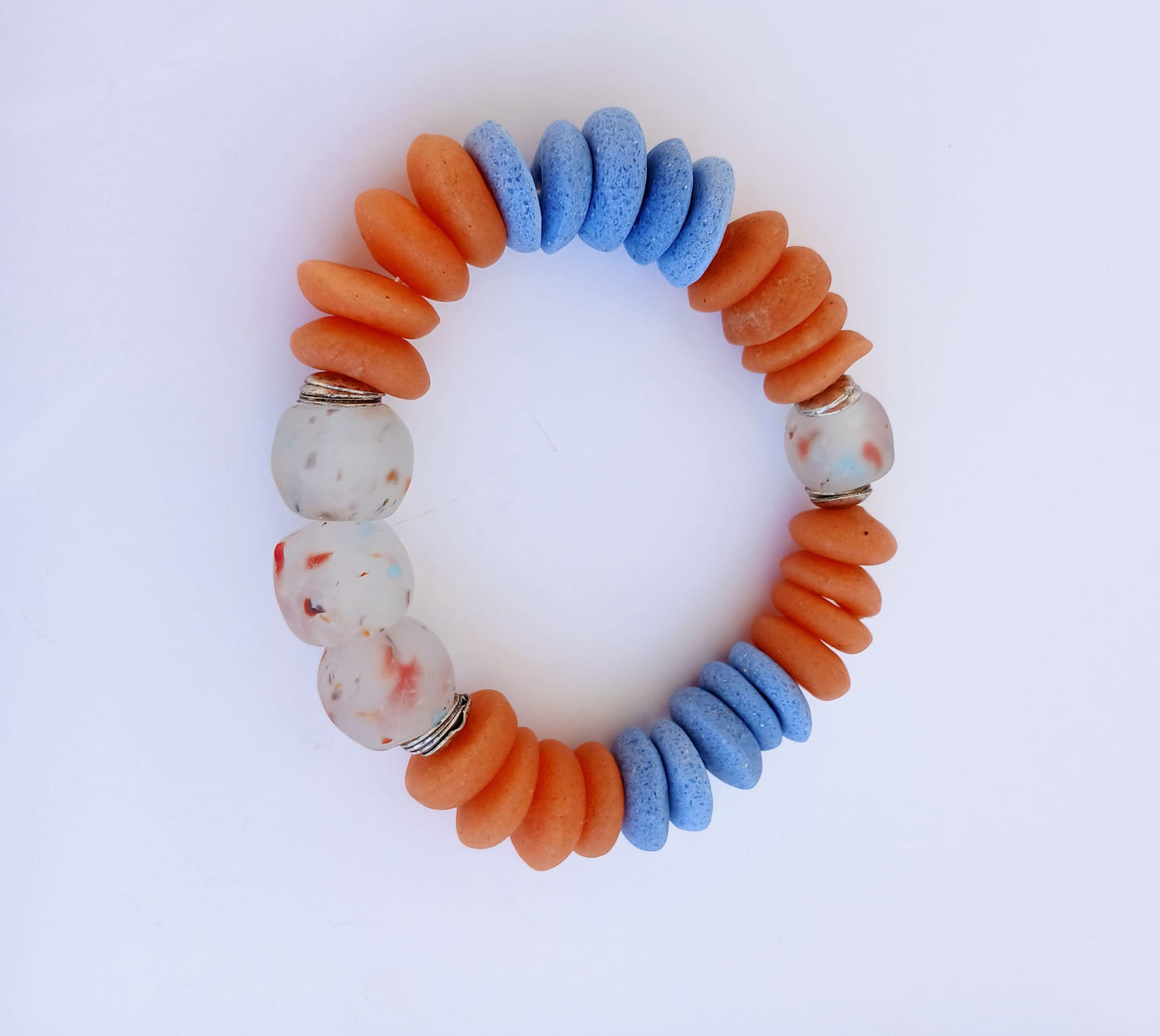Orange and Blue Ashanti Glass Beaded Bracelet featuring multicolor handmade beads crafted into a vibrant healing jewelry piece for men and women. This lucky charm bracelet blends traditional Ashanti craftsmanship with modern style, promoting positive energy and spiritual balance. Lightweight and durable, it makes a meaningful gift for him or her, perfect for everyday wear or special occasions, combining artisanal quality with bold, colorful design.