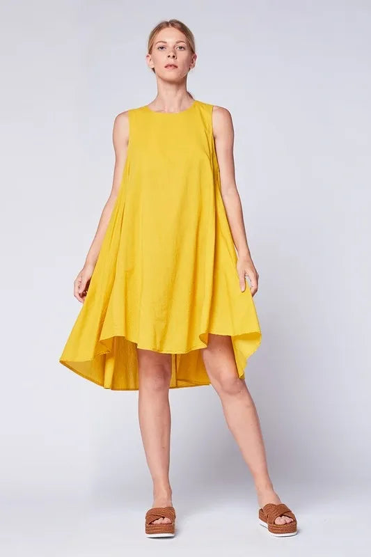 Asymmetrical Midi Tank Dress in mustard color crafted from soft cotton, designed for women seeking stylish comfort. This sleeveless, oversized summer dress features a unique asymmetrical hemline and breathable fabric, making it perfect for casual boho-inspired looks. Made in Italy with high-quality craftsmanship, it blends relaxed fit with elegant design for warm-weather outings or laid-back gatherings.