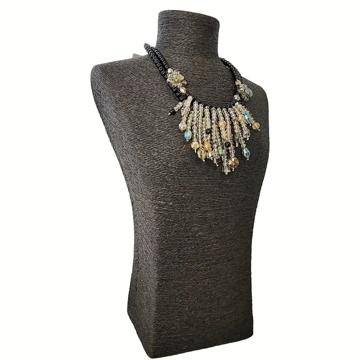 Aurora Borealis crystal and onyx bead necklace featuring a cascading statement design for women who love bold, elegant style. This gothic glam necklace sparkles with iridescent crystals and deep black beads, perfect for evening wear or special occasions. A stunning gift for her, it blends dark romance with shimmering beauty. Ideal for gothic, vintage, or glam-inspired looks, this necklace adds drama and sophistication to any outfit.