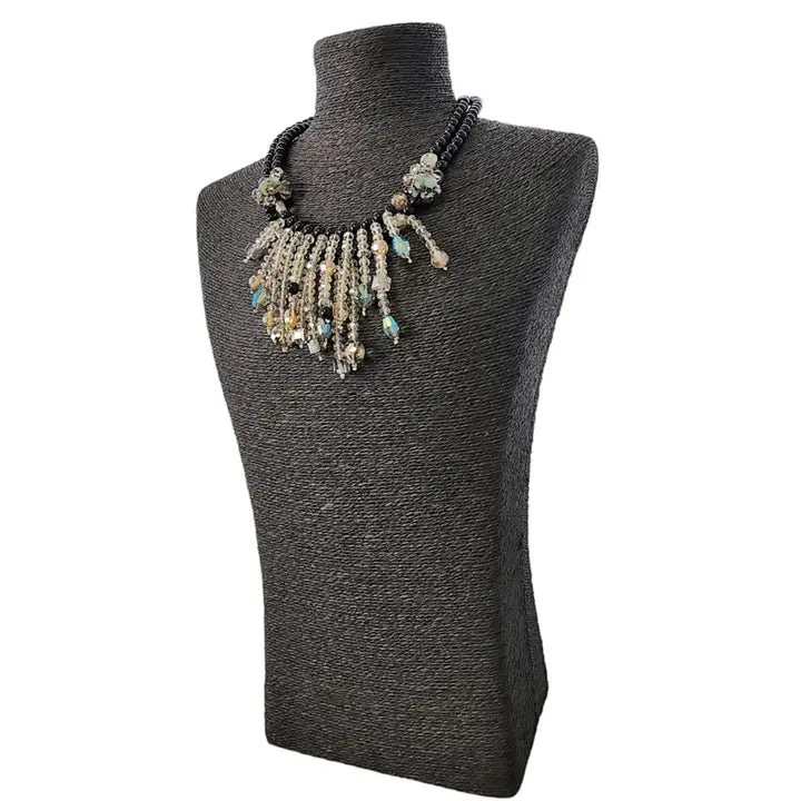 Aurora Borealis crystal and onyx bead necklace featuring a cascading statement design for women who love bold, elegant style. This gothic glam necklace sparkles with iridescent crystals and deep black beads, perfect for evening wear or special occasions. A stunning gift for her, it blends dark romance with shimmering beauty. Ideal for gothic, vintage, or glam-inspired looks, this necklace adds drama and sophistication to any outfit.