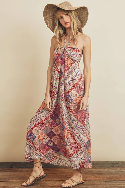 Berry Paisley Halter Dress is a boho-inspired maxi dress featuring a vibrant paisley print and a halter necktie for adjustable comfort. The baby doll bodice with a smocked back panel offers a flattering fit, while the flowy silhouette creates effortless summer style. Perfect as a casual maxi dress for warm weather, beach outings, or relaxed gatherings, this dress blends playful design with comfortable, breezy wear.