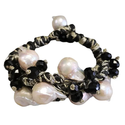 Black gold Edison freshwater pearl bracelet featuring a woven braided design, handcrafted for an elegant minimalist style. This handmade jewelry piece makes a perfect gift for her or bridesmaids, combining the natural luster of freshwater pearls with sleek black gold accents. Ideal for weddings, special occasions, or everyday wear, it offers timeless sophistication and subtle charm in a versatile accessory