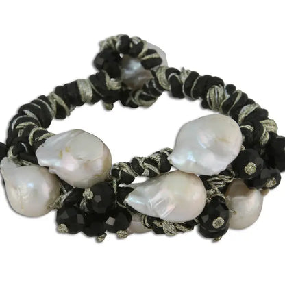 Black gold Edison freshwater pearl bracelet featuring a woven braided design, handcrafted for an elegant minimalist style. This handmade jewelry piece makes a perfect gift for her or bridesmaids, combining the natural luster of freshwater pearls with sleek black gold accents. Ideal for weddings, special occasions, or everyday wear, it offers timeless sophistication and subtle charm in a versatile accessory