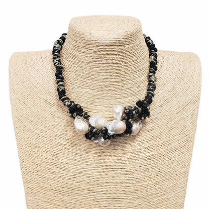 Black & Gold Multi Edison Freshwater Pearl Braided Necklace, a handmade statement jewelry piece for elegant women. Featuring lustrous Edison pearls woven into a black and gold braided cord, this necklace blends luxury with artisanal charm. Perfect for formal events, special occasions, or stylish everyday wear. A thoughtful gift for her, combining timeless beauty with modern craftsmanship in a unique, eye-catching design.