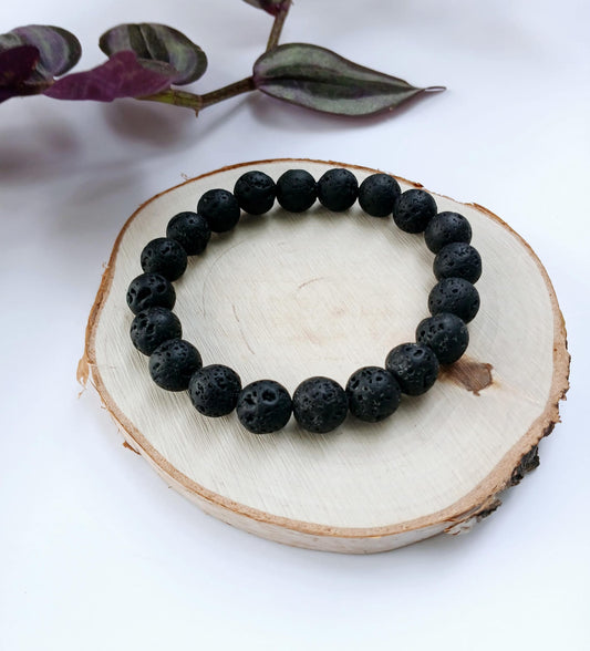 Black lava diffuser bracelet handmade with natural stone beads, designed for both men and women. This stylish aromatherapy accessory allows you to apply essential oils for calming, grounding benefits throughout the day. A thoughtful anniversary gift or wellness-inspired jewelry piece, it combines rugged elegance with holistic function. Perfect for daily wear, stress relief, and a natural touch of style