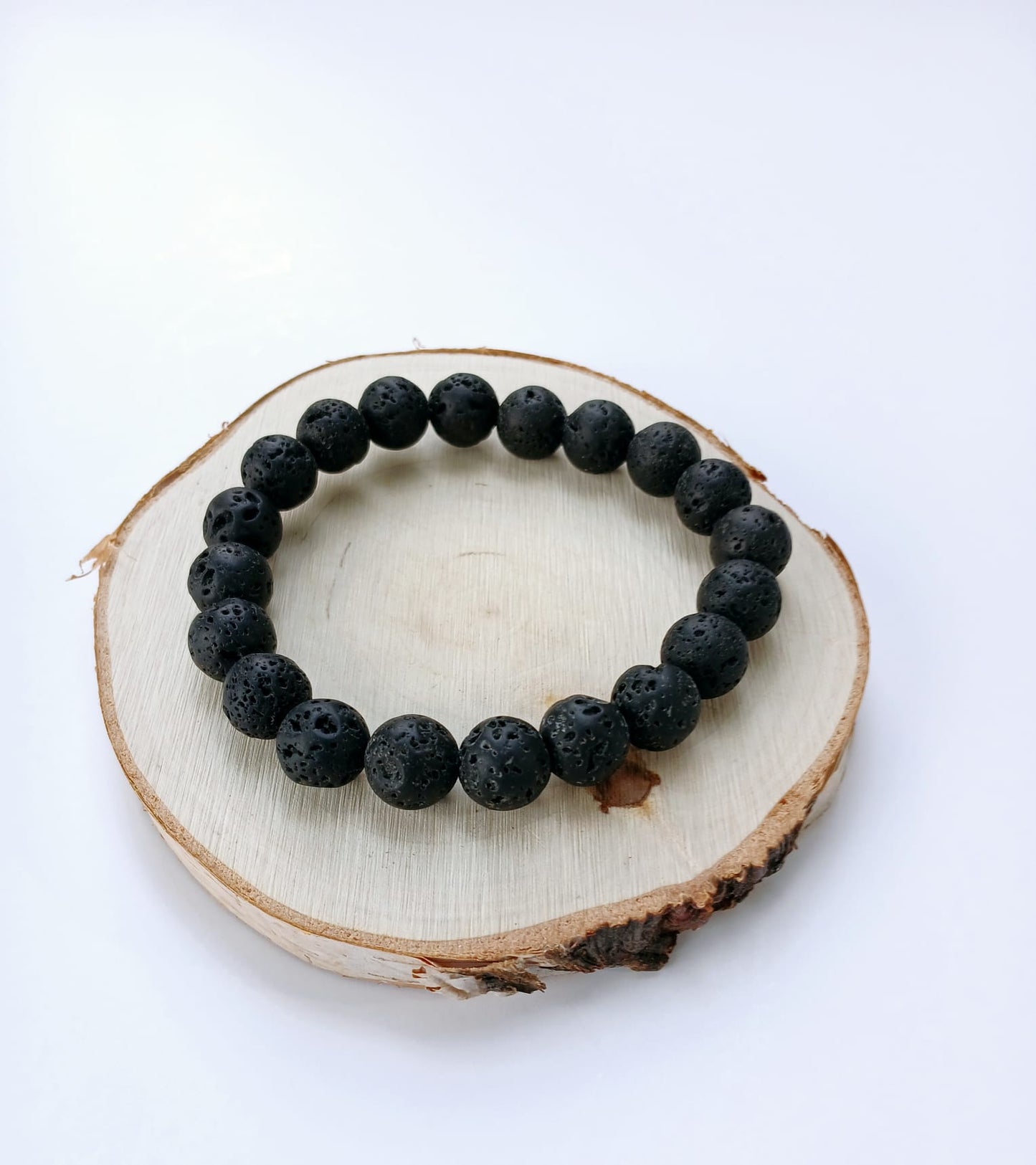Black lava diffuser bracelet handmade with natural stone beads, designed for both men and women. This stylish aromatherapy accessory allows you to apply essential oils for calming, grounding benefits throughout the day. A thoughtful anniversary gift or wellness-inspired jewelry piece, it combines rugged elegance with holistic function. Perfect for daily wear, stress relief, and a natural touch of style