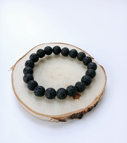 Black lava diffuser bracelet handmade with natural stone beads, designed for both men and women. This stylish aromatherapy accessory allows you to apply essential oils for calming, grounding benefits throughout the day. A thoughtful anniversary gift or wellness-inspired jewelry piece, it combines rugged elegance with holistic function. Perfect for daily wear, stress relief, and a natural touch of style