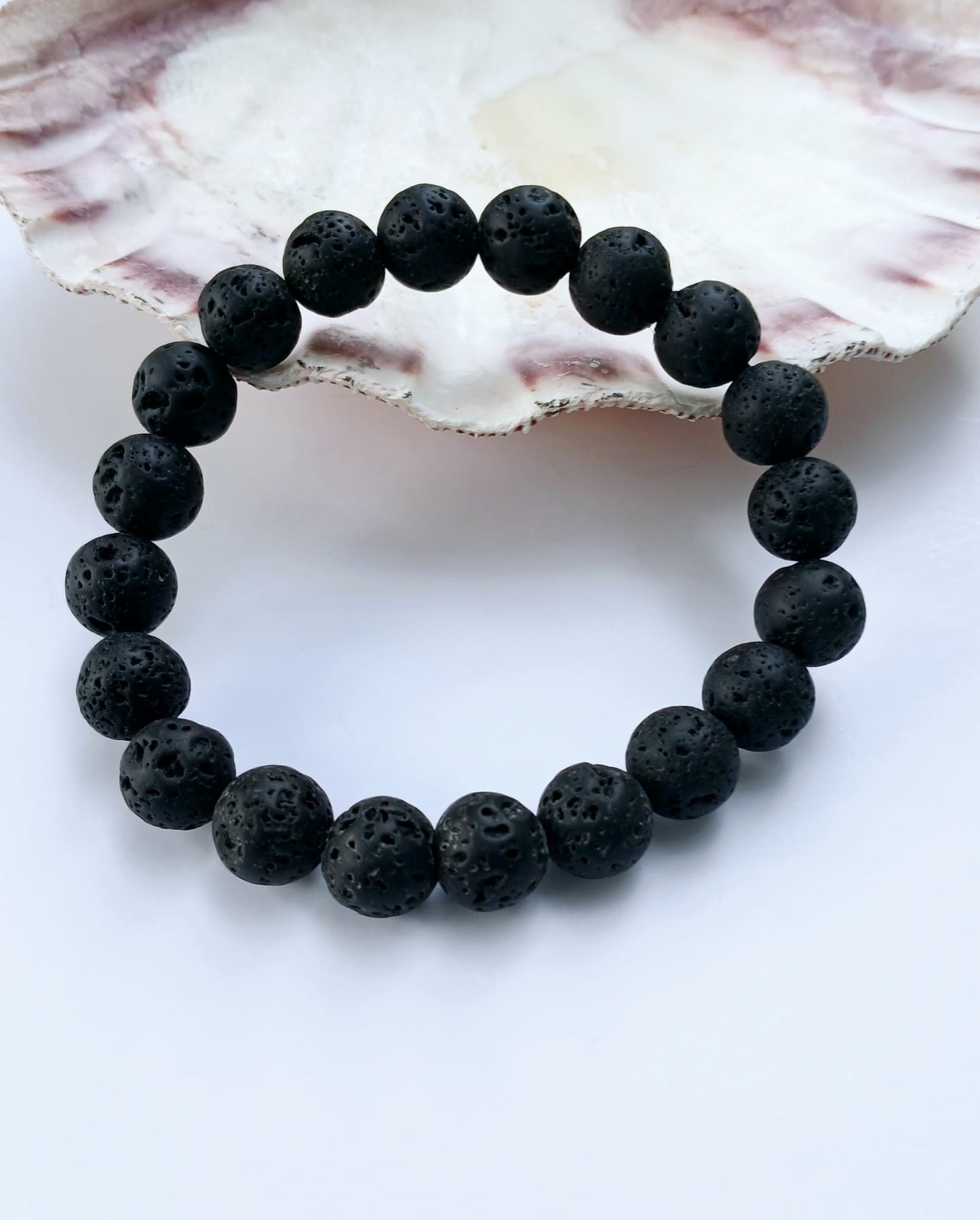 Black lava diffuser bracelet handmade with natural stone beads, designed for both men and women. This stylish aromatherapy accessory allows you to apply essential oils for calming, grounding benefits throughout the day. A thoughtful anniversary gift or wellness-inspired jewelry piece, it combines rugged elegance with holistic function. Perfect for daily wear, stress relief, and a natural touch of style