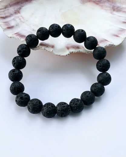 Black lava diffuser bracelet handmade with natural stone beads, designed for both men and women. This stylish aromatherapy accessory allows you to apply essential oils for calming, grounding benefits throughout the day. A thoughtful anniversary gift or wellness-inspired jewelry piece, it combines rugged elegance with holistic function. Perfect for daily wear, stress relief, and a natural touch of style