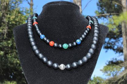Black Onyx Carnelian Lapis Lazuli Necklace featuring a handcrafted combination of powerful crystals designed for chakra healing and spiritual balance. This unique necklace blends black onyx, vibrant carnelian, and deep blue lapis lazuli stones, making it perfect for men and women who appreciate meaningful, artisan jewelry. Ideal as a spiritual gift, it promotes energy alignment and holistic wellness while adding natural beauty and style to everyday wear or meditation practice.