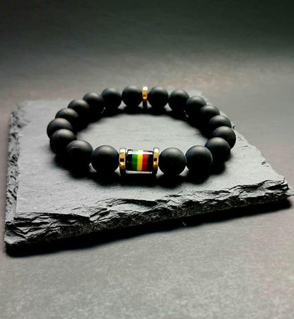 Black Onyx Beaded Rasta Bracelet featuring vibrant reggae colors, handmade with natural gemstone beads for men who love boho and Rastafarian-inspired style. This unisex bracelet symbolizes protection, strength, and cultural pride, making it a meaningful gift for him. Perfect for casual wear, festivals, or spiritual occasions, it blends bold colors with grounding black onyx stones. A stylish accessory that celebrates heritage and positive energy.