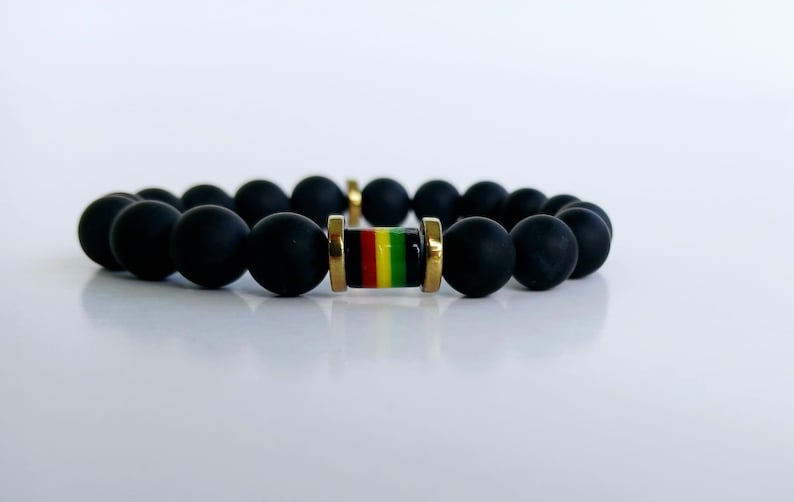 Black Onyx Beaded Rasta Bracelet featuring vibrant reggae colors, handmade with natural gemstone beads for men who love boho and Rastafarian-inspired style. This unisex bracelet symbolizes protection, strength, and cultural pride, making it a meaningful gift for him. Perfect for casual wear, festivals, or spiritual occasions, it blends bold colors with grounding black onyx stones. A stylish accessory that celebrates heritage and positive energy.