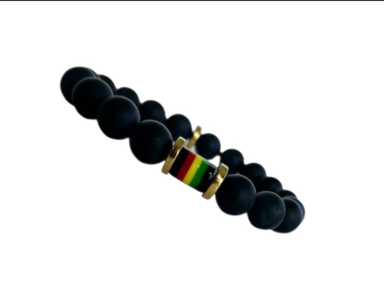 Black Onyx Beaded Rasta Bracelet featuring vibrant reggae colors, handmade with natural gemstone beads for men who love boho and Rastafarian-inspired style. This unisex bracelet symbolizes protection, strength, and cultural pride, making it a meaningful gift for him. Perfect for casual wear, festivals, or spiritual occasions, it blends bold colors with grounding black onyx stones. A stylish accessory that celebrates heritage and positive energy.