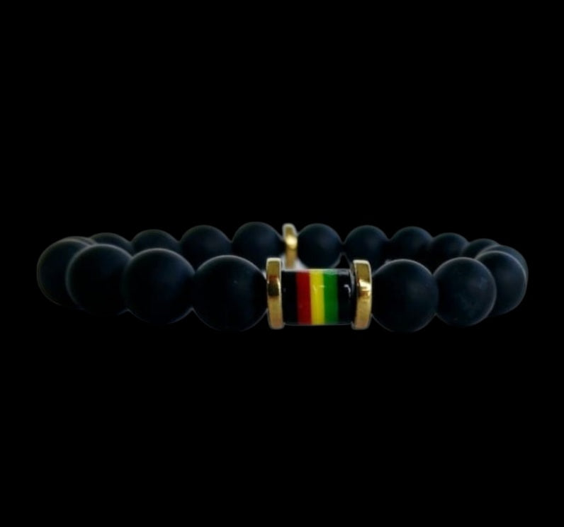 Black Onyx Beaded Rasta Bracelet featuring vibrant reggae colors, handmade with natural gemstone beads for men who love boho and Rastafarian-inspired style. This unisex bracelet symbolizes protection, strength, and cultural pride, making it a meaningful gift for him. Perfect for casual wear, festivals, or spiritual occasions, it blends bold colors with grounding black onyx stones. A stylish accessory that celebrates heritage and positive energy.
