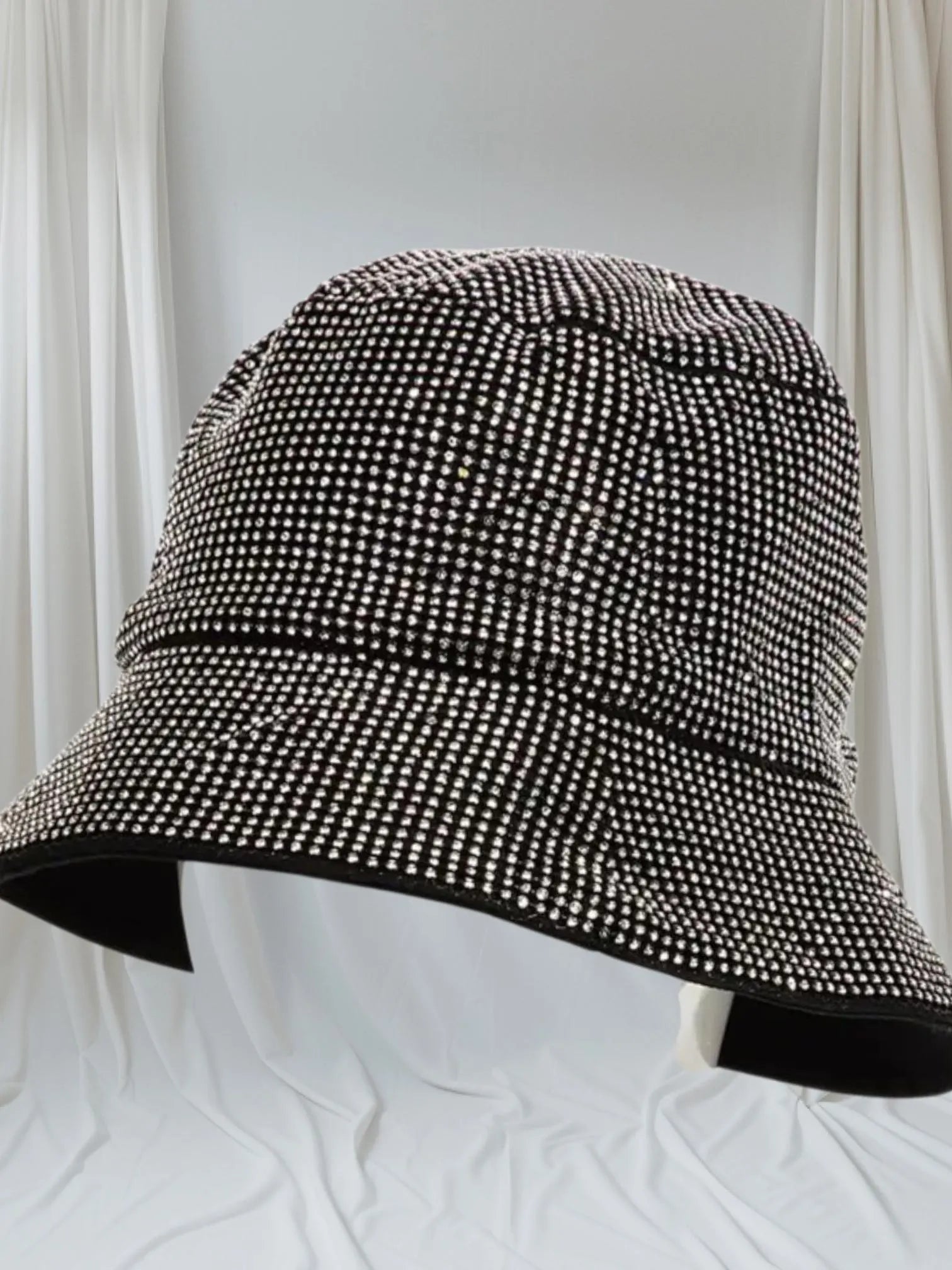 Stylish Rhinestone Bucket Hat designed for men and women, featuring sparkling rhinestones that add glamour and shine to fall and winter outfits. This trendy unisex hat is perfect for festivals, parties, and everyday wear, combining fashion with comfort. Made with quality materials for durability and a comfortable fit, it’s an eye-catching accessory that elevates any casual or festive look. Ideal gift for anyone who loves stylish, statement headwear.
