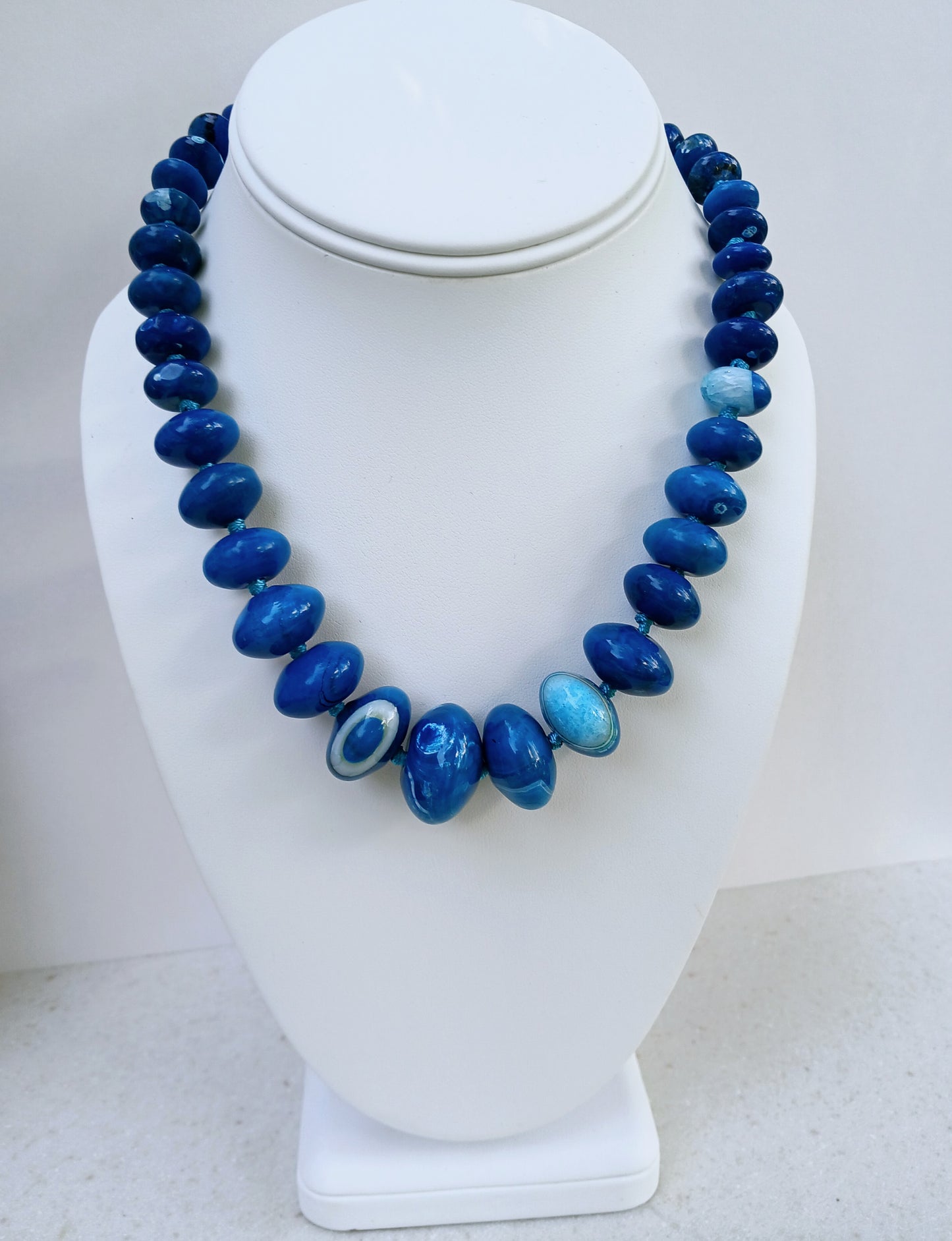 Blue Agate Necklace featuring a natural gemstone known for its spiritual healing properties. This elegant crystal jewelry piece is perfect for women seeking balance and inner peace. The vibrant blue agate pendant adds a calming energy, ideal for daily wear or meditation. Designed for layering or worn as a choker, it’s a meaningful gift for birthdays, wellness lovers, or anyone drawn to the beauty of natural stones.