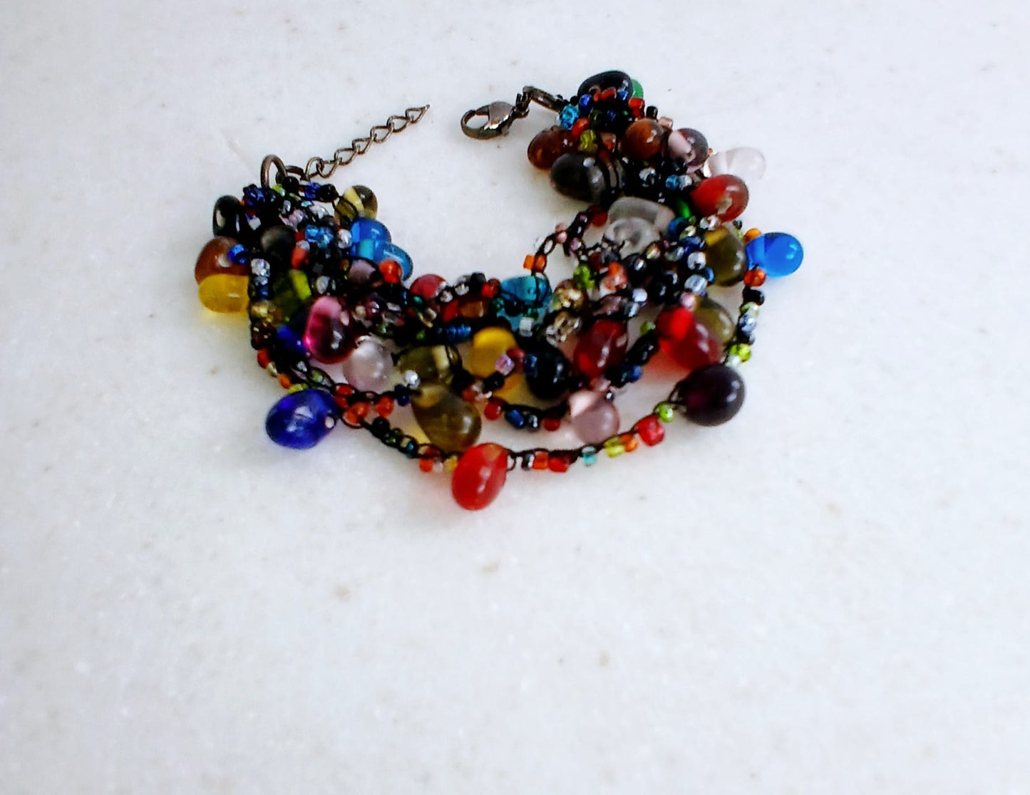 Glass Bead Black Thread Bracelet for Men and Women, featuring an adjustable handmade design perfect for a minimalist boho look. This unisex wristband combines sleek black thread with delicate glass beads for a subtle yet stylish accessory. Ideal as a friendship bracelet or everyday jewelry piece, it offers comfort and versatility. A meaningful handmade gift for anyone who appreciates simple, modern bohemian fashion.
