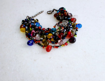 Glass Bead Black Thread Bracelet for Men and Women, featuring an adjustable handmade design perfect for a minimalist boho look. This unisex wristband combines sleek black thread with delicate glass beads for a subtle yet stylish accessory. Ideal as a friendship bracelet or everyday jewelry piece, it offers comfort and versatility. A meaningful handmade gift for anyone who appreciates simple, modern bohemian fashion.