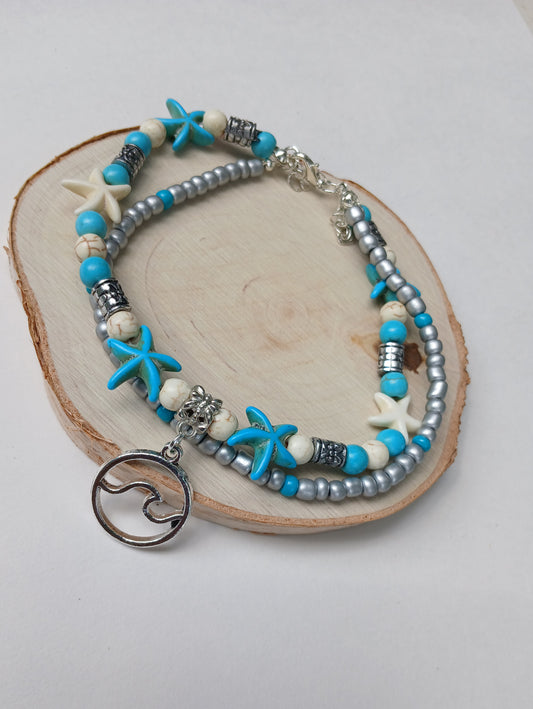 Double layer starfish anklet featuring delicate Miyuki beads, perfect for boho summer jewelry lovers. This adjustable handmade beach anklet combines coastal charm with vibrant colors, ideal for beach vacations, festivals, and everyday wear. A thoughtful gift for her, adding playful seaside vibes and lightweight comfort to any outfit. Stylish and versatile, it’s a must-have accessory for summer and ocean-inspired fashion