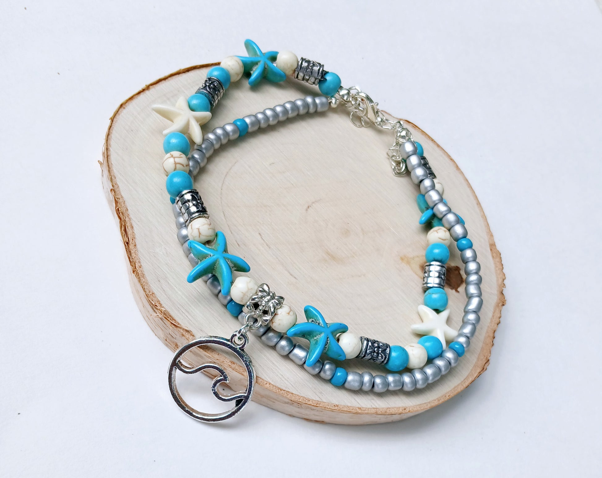 Double layer starfish anklet featuring delicate Miyuki beads, perfect for boho summer jewelry lovers. This adjustable handmade beach anklet combines coastal charm with vibrant colors, ideal for beach vacations, festivals, and everyday wear. A thoughtful gift for her, adding playful seaside vibes and lightweight comfort to any outfit. Stylish and versatile, it’s a must-have accessory for summer and ocean-inspired fashion
