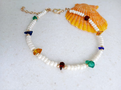 Boho Pearl Anklet for Women featuring delicate glass chip beads, handmade with care for a unique and stylish touch. This layered ankle bracelet blends coastal charm with bohemian flair, making it a perfect summer foot accessory. Ideal for beach days, festivals, or casual outings, this bohemian anklet is both lightweight and fashionable. A thoughtful gift for women who love handmade beach jewelry and boho fashion. Great for layering or wearing alone.