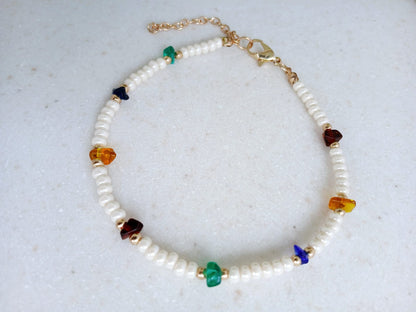 Boho Pearl Anklet for Women featuring delicate glass chip beads, handmade with care for a unique and stylish touch. This layered ankle bracelet blends coastal charm with bohemian flair, making it a perfect summer foot accessory. Ideal for beach days, festivals, or casual outings, this bohemian anklet is both lightweight and fashionable. A thoughtful gift for women who love handmade beach jewelry and boho fashion. Great for layering or wearing alone.
